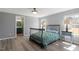 Main bedroom featuring wood-look flooring, closet, and attached bathroom at 1425 Country Pond Ln, Willow Springs, NC 27592