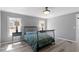 Main bedroom featuring wood-look flooring, a closet and natural light at 1425 Country Pond Ln, Willow Springs, NC 27592