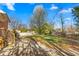 Spacious backyard features a concrete patio and a large grassy area, perfect for outdoor activities at 1506 N Mebane St, Burlington, NC 27217