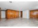 Spacious basement features wood paneling, bright lights, and easy access to stairs and an adjacent bathroom at 1506 N Mebane St, Burlington, NC 27217