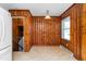 Dining room boasting wood paneling, tile flooring, and natural light from window at 1506 N Mebane St, Burlington, NC 27217