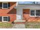 Close up of a home's front entrance showing a classic white door and brick facade at 1506 N Mebane St, Burlington, NC 27217