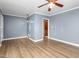 Living room with wood-look floors and ceiling fan at 1506 N Mebane St, Burlington, NC 27217