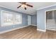 Cozy living room featuring hardwood floors, natural light, and a staircase view at 1506 N Mebane St, Burlington, NC 27217
