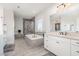 Luxury bathroom with a soaking tub, walk-in shower, and dual sink vanity at 1515 Spring Overlook Ln, Hillsborough, NC 27278