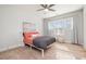 Cozy bedroom with neutral walls, carpet, a ceiling fan, natural light, and a bed with colorful accents at 1515 Spring Overlook Ln, Hillsborough, NC 27278