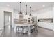 Spacious kitchen features a large island with seating, modern appliances, and pendant lighting at 1515 Spring Overlook Ln, Hillsborough, NC 27278