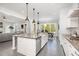 Open kitchen boasts stainless steel appliances and a view into the dining and living spaces at 1515 Spring Overlook Ln, Hillsborough, NC 27278