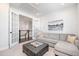 Inviting living room with French doors and comfortable seating arrangement with an ottoman at 1515 Spring Overlook Ln, Hillsborough, NC 27278