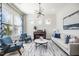 Inviting living room featuring stylish furniture, large windows, and ample natural light at 1515 Spring Overlook Ln, Hillsborough, NC 27278
