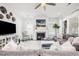 Cozy living room with a fireplace, comfortable seating, and stylish decor at 1515 Spring Overlook Ln, Hillsborough, NC 27278
