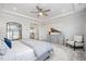 Serene main bedroom features tray ceilings, neutral tones and an ensuite bathroom at 1515 Spring Overlook Ln, Hillsborough, NC 27278