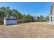 View of backyard showing shed and expansive lot at 1613 Osprey Ridge Dr, Willow Springs, NC 27592