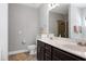 Modern bathroom featuring dual sinks, granite countertops, and a glass-enclosed shower at 1613 Osprey Ridge Dr, Willow Springs, NC 27592