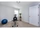 Home gym equipped with stationary bike, yoga ball, and hardwood floors at 1613 Osprey Ridge Dr, Willow Springs, NC 27592