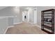 Hallway provides access to rooms on the upper level with view to a functional home office at 1613 Osprey Ridge Dr, Willow Springs, NC 27592