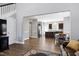 This spacious living room with hardwood floors transitions seamlessly into the kitchen, offering an open and airy feel at 1613 Osprey Ridge Dr, Willow Springs, NC 27592