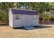 Garden shed with double doors and ramp, perfect for storage or hobby space at 1613 Osprey Ridge Dr, Willow Springs, NC 27592