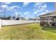 Large backyard with privacy fence and access to a screened-in porch area at 19 Tobenton Ct, Clayton, NC 27520