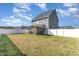 Expansive backyard featuring a well-maintained lawn and a screened porch at 19 Tobenton Ct, Clayton, NC 27520