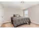 Bedroom featuring neutral walls, carpet, one window and a queen bed with patterned comforter at 19 Tobenton Ct, Clayton, NC 27520