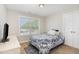 Comfortable bedroom featuring a bright window and closet with white double doors at 19 Tobenton Ct, Clayton, NC 27520