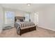 Bedroom with neutral walls, carpet, and a wooden bed frame plus bench with built-in storage at 19 Tobenton Ct, Clayton, NC 27520