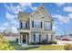 Charming two-story home featuring manicured lawn, beautiful architectural details, and inviting curb appeal at 19 Tobenton Ct, Clayton, NC 27520
