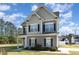 Charming two-story home featuring manicured lawn, beautiful architectural details, and inviting curb appeal at 19 Tobenton Ct, Clayton, NC 27520