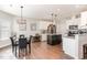 Open kitchen with a central island, stainless steel appliances, and seamless flow to the dining area at 19 Tobenton Ct, Clayton, NC 27520