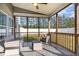 Relaxing screened porch with comfortable seating, perfect for enjoying the outdoors at 19 Tobenton Ct, Clayton, NC 27520