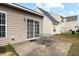 The backyard features a patio with a table and sliding glass doors providing easy access to indoor-outdoor living at 1945 Red Quartz Dr, Raleigh, NC 27610