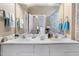 Bathroom featuring a double vanity and a large mirror reflecting the shower at 1945 Red Quartz Dr, Raleigh, NC 27610