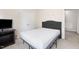 Bedroom featuring simple furnishing, neutral walls, and ample closet space at 1945 Red Quartz Dr, Raleigh, NC 27610