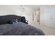 Bedroom featuring carpet, neutral walls, writing on the wall, closet, bed, and desk chair at 1945 Red Quartz Dr, Raleigh, NC 27610