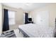 Bedroom with neutral-toned walls, a simple bed frame, and ample closet space at 1945 Red Quartz Dr, Raleigh, NC 27610
