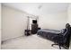 Bedroom featuring simple furnishing, neutral walls, carpet, and small window with natural light at 1945 Red Quartz Dr, Raleigh, NC 27610