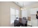 Dining area featuring dark wood table, large window, and chandelier-style lighting at 1945 Red Quartz Dr, Raleigh, NC 27610