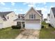 Charming two-story home with a two-car garage, and inviting curb appeal at 1945 Red Quartz Dr, Raleigh, NC 27610