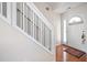 Bright foyer featuring hardwood floors and a staircase at 1945 Red Quartz Dr, Raleigh, NC 27610