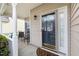 Cozy front porch with seating, and a decorative door at 1945 Red Quartz Dr, Raleigh, NC 27610