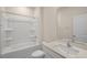 Clean bathroom featuring a tub-shower combination, a toilet, and a vanity with solid surface countertops at 195 Hawksmoore Ln, Lillington, NC 27546
