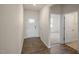 Welcoming entryway with wood floors, white trim, and a view into a bright, carpeted room at 195 Hawksmoore Ln, Lillington, NC 27546