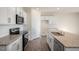 Bright kitchen features white cabinets, subway tile backsplash, stainless appliances, and granite countertops at 195 Hawksmoore Ln, Lillington, NC 27546