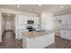 Bright kitchen features white cabinets, subway tile backsplash, stainless appliances, and granite countertops at 195 Hawksmoore Ln, Lillington, NC 27546