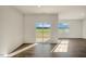 Bright living room featuring wood-look floors and sliding glass doors to let in natural light at 195 Hawksmoore Ln, Lillington, NC 27546