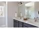 Elegant bathroom with double vanity, sleek countertops, modern fixtures, and a glass-enclosed shower for a luxurious feel at 2011 Trident Maple Ln, Chapel Hill, NC 27517