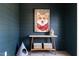 A hallway features stylish decor, including a dog art print, wooden console, and unique pet furniture at 2011 Trident Maple Ln, Chapel Hill, NC 27517