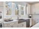 Bright kitchen featuring modern appliances, a stylish backsplash, and ample storage at 2011 Trident Maple Ln, Chapel Hill, NC 27517