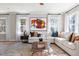 Comfortable living room featuring a large sectional sofa, modern art, and natural light at 2011 Trident Maple Ln, Chapel Hill, NC 27517